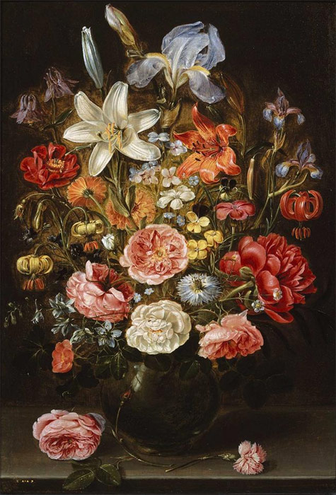 Flowers In A Glass Vase On A Wooden Table